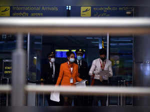 Hyderabad, Jan 30 (ANI): Airport Staff wearing face mask at  the entrance of Raj...