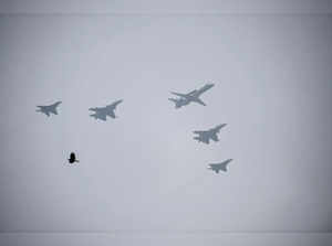 New Delhi: An AWACS with four IAF Su -30MKI flies past in a formation during the...