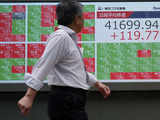 Japan's Nikkei slips as yen gains; higher bond yields lift banks