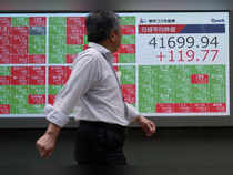 Japan's Nikkei slips as yen gains; higher bond yields lift banks