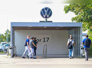 Volkswagen employees leave the Wolfsburg plant