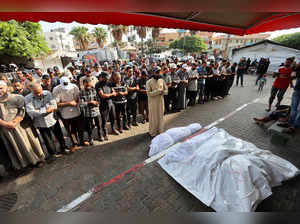 Palestinians mourn loved ones killed in Israeli strikes, in Deir Al-Balah