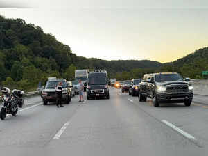 Drivers park on the the lanes of the I-75 highway after reports of multiple people shot in Kentucky