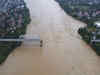 Flooding sweeps away bus and bridge collapses in Vietnam as storm deaths rise to 59