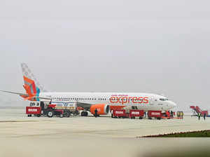 An inaugural flight of Air India Express lands at Ayodhya...