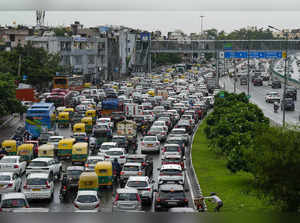 New Delhi: Vehicles move during a traffic jam on National Highway 24, in New Del...