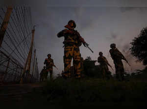 Jammu: Women personnel of Border Security Force (BSF) patrol near the border fen...