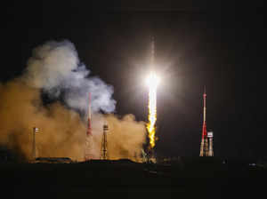 A Soyuz craft with 2 Russians and 1 American docks at the International Space Station