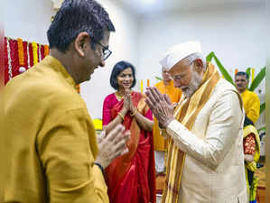 **EDS: IMAGE VIA PMO** New Delhi: Prime Minister Narendra Modi exchanges greetin...