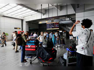 Passengers wait at Terminal 2 of Indira Gandhi International Airport in New Delhi