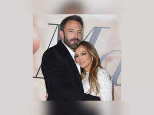 Wife swap? After Matt Damon holds Jennifer Lopez's hand, Ben Affleck kisses his wife Barroso's head