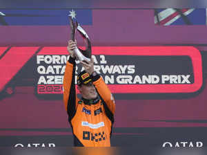 McLaren driver Oscar Piastri of Australia celebrates after he won the Formula On...