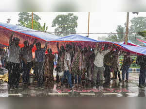 **EDS: RPT CORRECTS DETAILS AND HEADLINE** Kolkata: Agitators take cover during ...