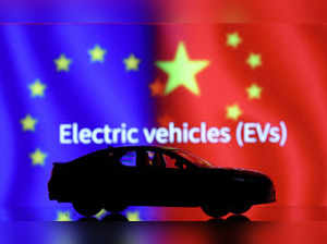 FILE PHOTO: Illustration shows Car miniature, "Electric vechicles (EVs)" words, EU and Chinese flags