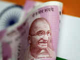 Rupee rises to 2 month peak boosted by yuan rally, likely inflows