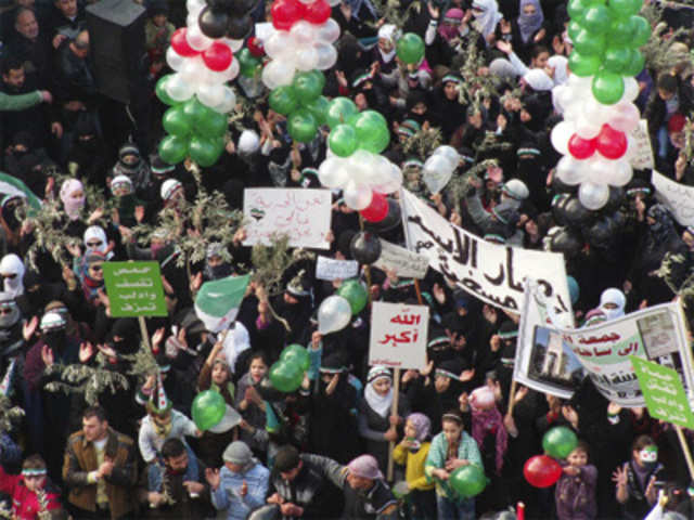Demonstrators protest against Syria President