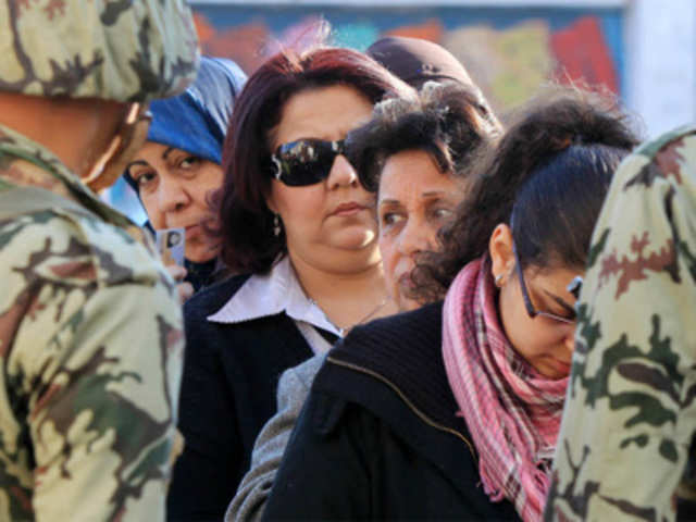 Egyptian women queue outside a polling station 