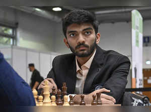 Gukesh D of India looks on as he plays against Richard Rapport of Hungary during...