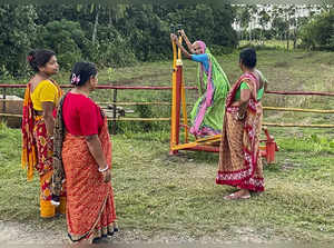 **EDS: IMAGE VIA BSF** Nadia: Locals at an open air gym created by the BSF, alon...