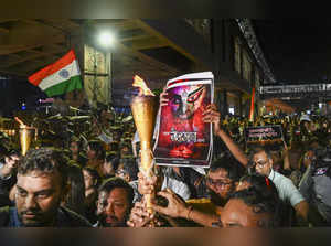 Kolkata: Members of Citizen Forum participate in torch rally against the alleged...