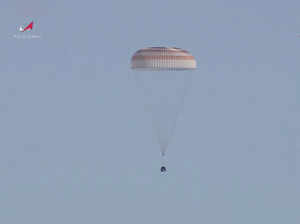 A Soyuz capsule with 2 Russians and 1 American from the International Space Station returns to Earth