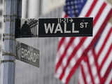 Wall St ends slightly higher after Fed policymakers back rate cuts