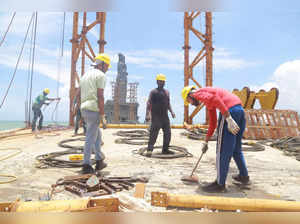 Kanyakumari: Workers during the construction of a glass bridge which will connec...