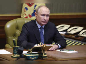 Russian President Vladimir Putin chairs a Security Council meeting via videoconf...