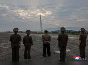 North Korean leader Kim Jong-un looks on during the test of what KCNA described as a new tactical ballistic missile