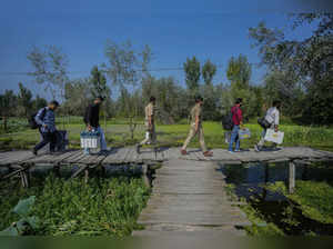 Residents in India-controlled Kashmir vote in the second phase of polls surrounded by heavy security