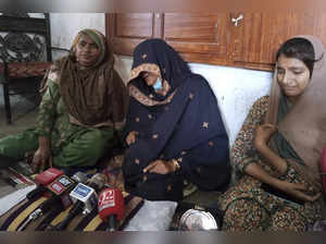 Family of Shah Nawaz, a doctor who was accused of blasphemy, from left, mother R...