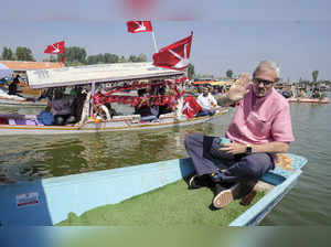 Srinagar: National Conference Vice President Omar Abdullah holds the party flag ...