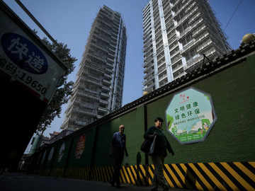 Top Chinese cities to lift key home purchase curbs to boost market