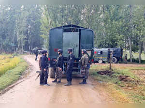 Kulgam: Security personnel during an encounter with militants at Adigam village,...