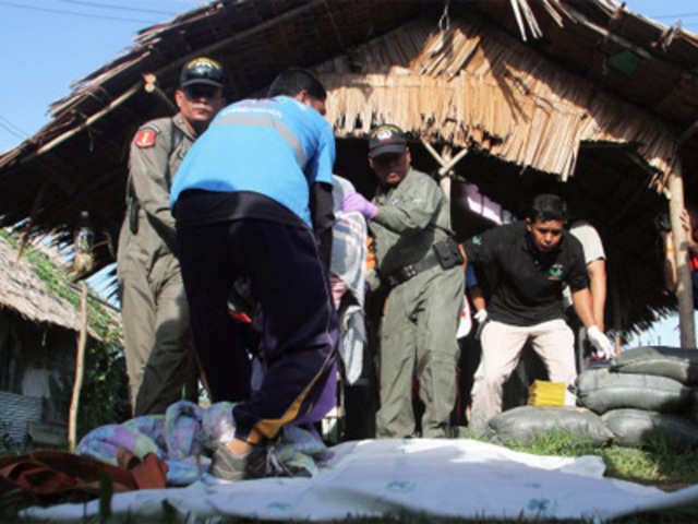 Thai police inspect bodies of killed defence volunteers