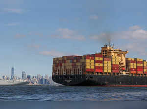 A ship carries shipping containers in Upper Bay, New York