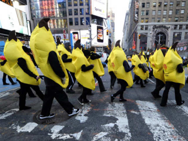People dressed in banana costumes representing Jamba Juice walk