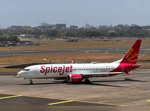 FILE PHOTO: A SpiceJet passenger aircraft taxis on the tarmac at Chhatrapati Shivaji International Airport in Mumbai