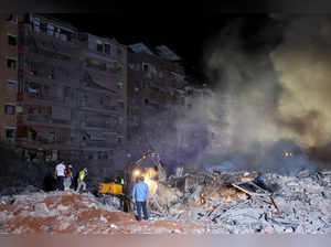 Smoke rises after explosions, in Beirut