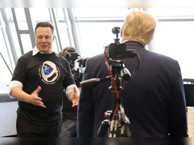 FILE PHOTO: Elon Musk is pictured with Donald Trump in 2020