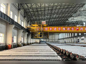 FILE PHOTO: Employees work at a copper smelter in Yantai