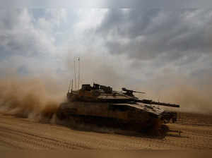 An Israeli tank manoeuvres near the Israel-Gaza border, in southern Israel