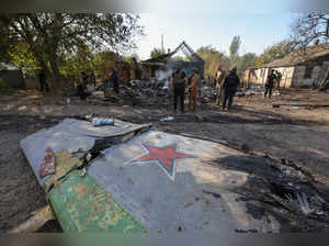 Ukrainian service members inspect parts of a Russian aerial vehicle in the town of Kostiantynivka