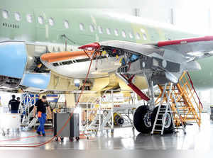 FILE PHOTO: Employees of Airbus are seen in a new A320 production line at the Airbus plant in Hamburg