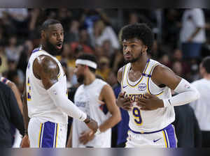 LeBron and son Bronny James play together for the first time in a preseason game for the Lakers