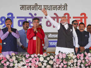 Jammu: Prime Minister Narendra Modi with J&K BJP President Ravinder Raina during...