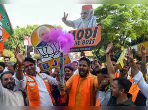 New Delhi, Oct 08 (ANI): Bharatiya Janata Party (BJP) supporters holding placard...