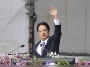 Taiwanese President Lai Ching-te waves during National Day celebrations in front...