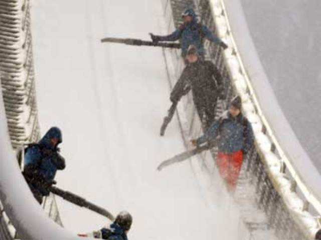 Volunteers clear the jumping hill