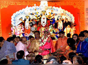 Patna : Devotees seek blessings from a girl child (kumari Durga) girl during 'Ku...